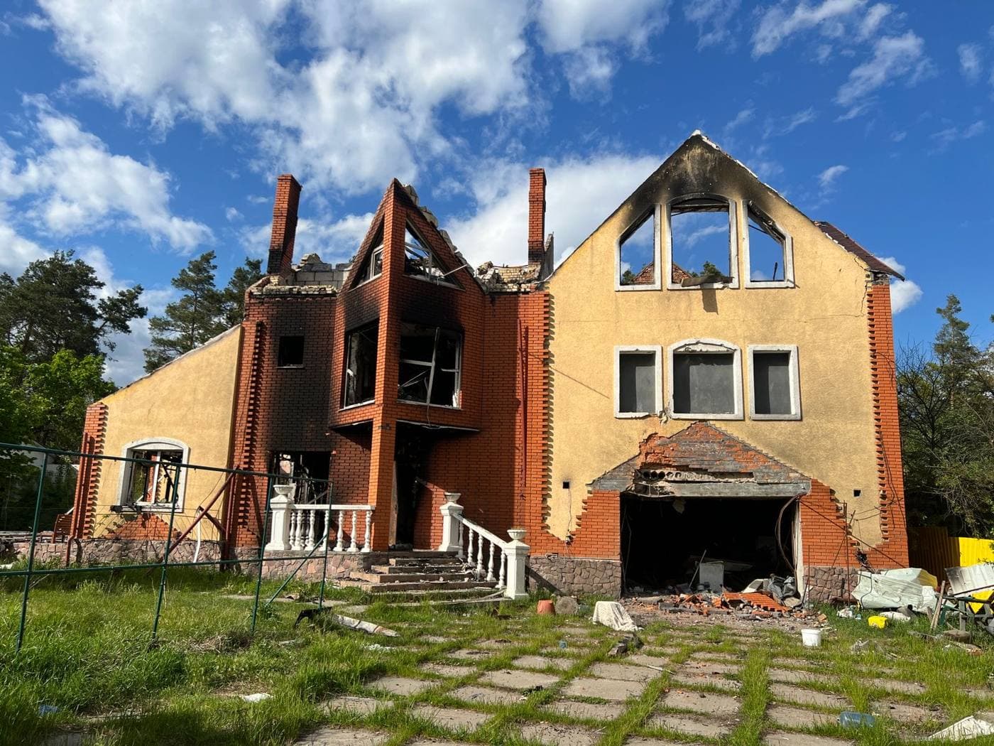 Brick house left roofless and burned out after a fire