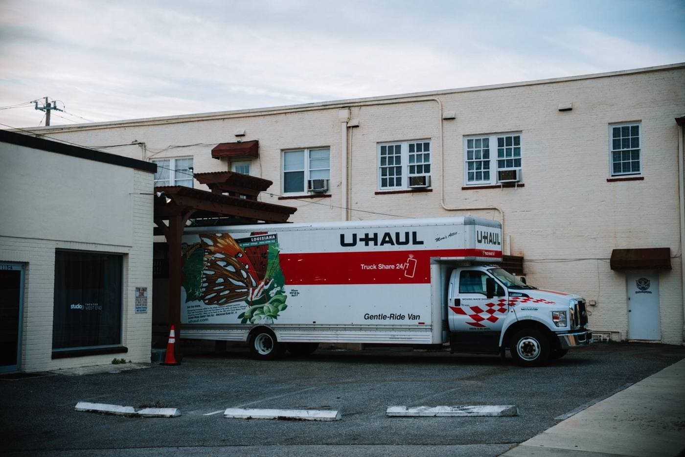 Moving truck parked outside a building